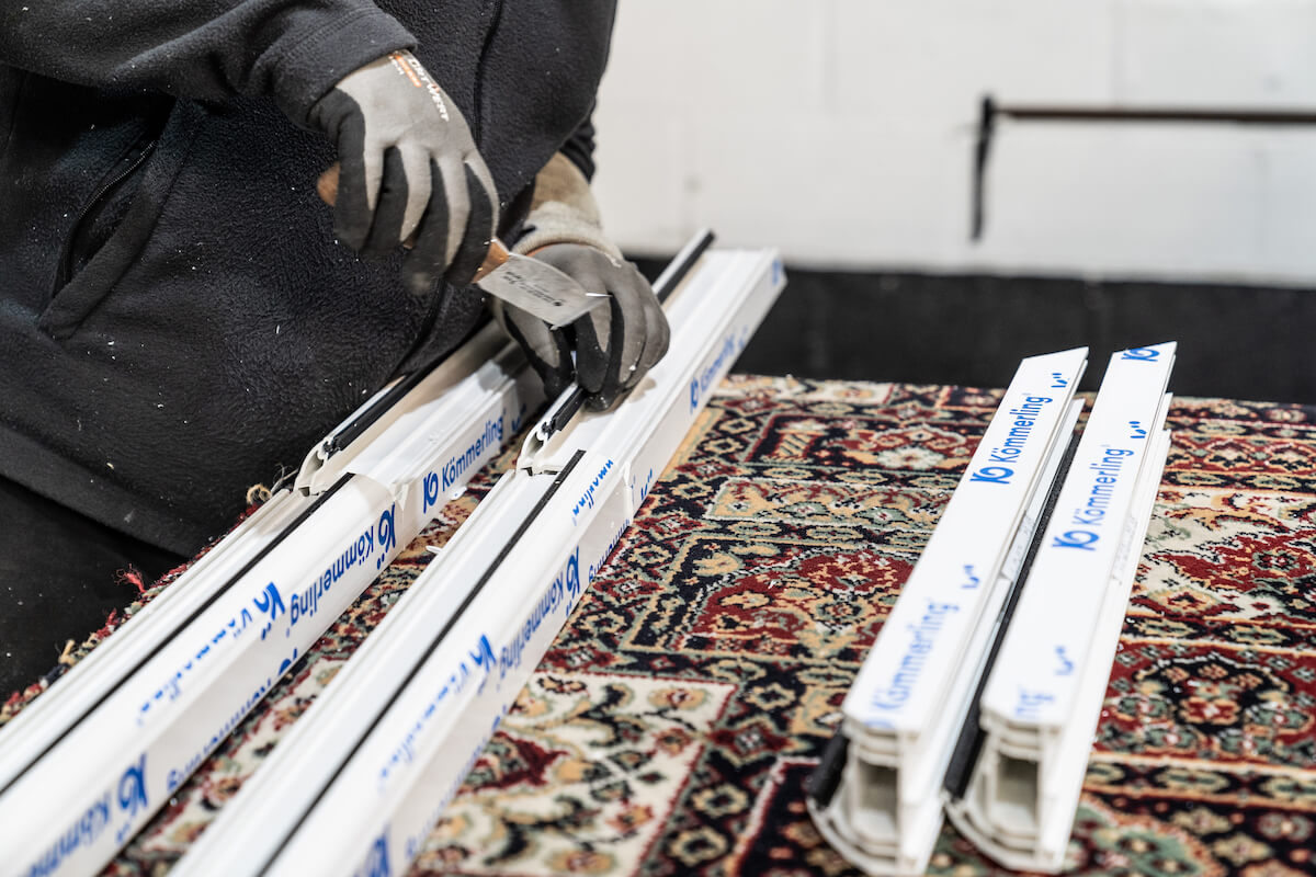 Genius' employee working with uPVC profiles