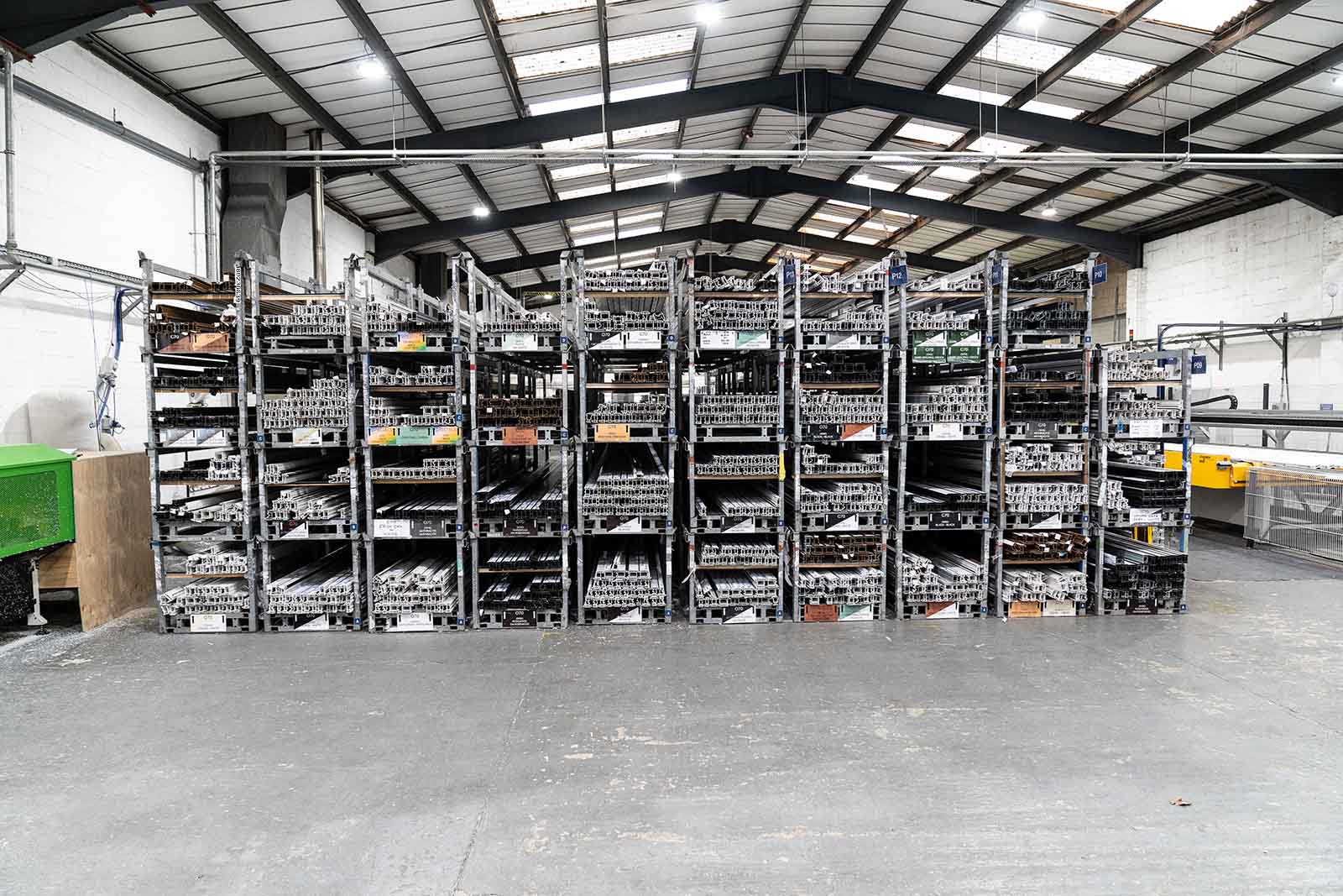 Factory image showing lots of uPVC profiles on shelves