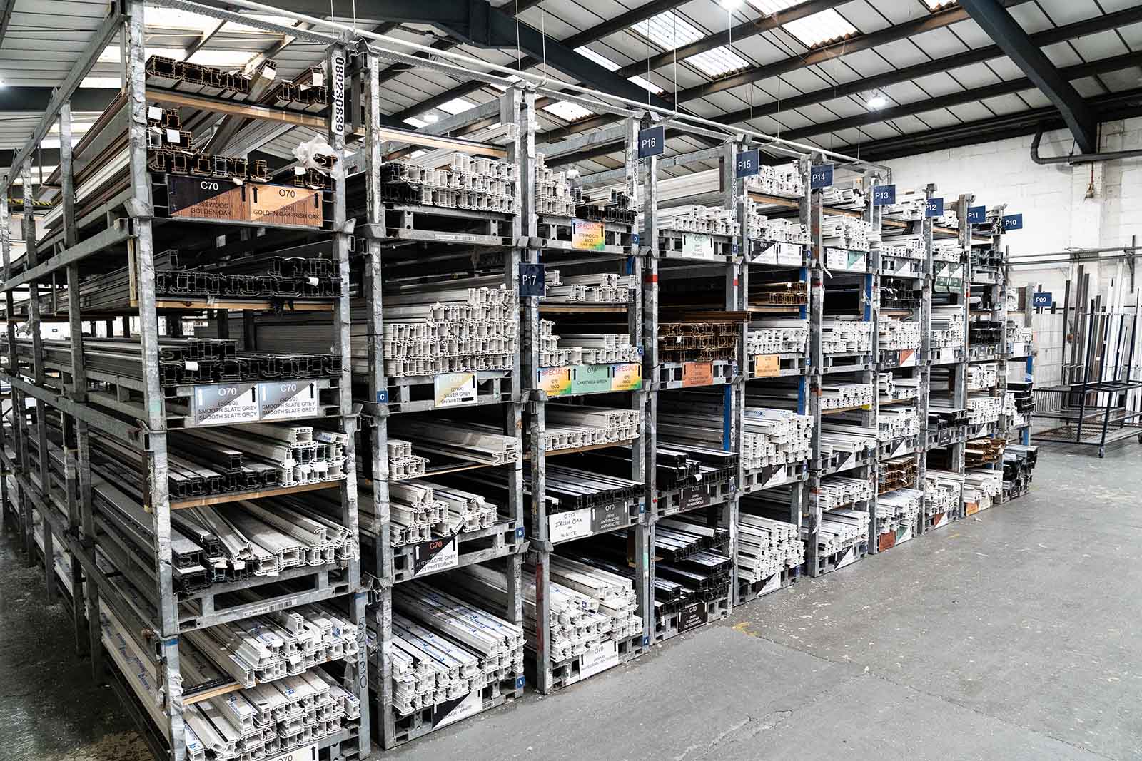 Factory image showing lots of uPVC profiles on shelves